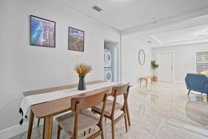 a dining room with a table and chairs at Miami Lux Vacations - Villa in Miami