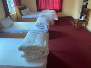 Postel nebo postele na pokoji v ubytování Prashiddha Resort