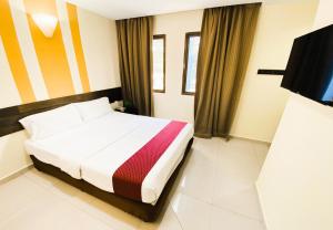 Sun Inns D'mind 3 Seri Kembangan客房内的一张或多张床位