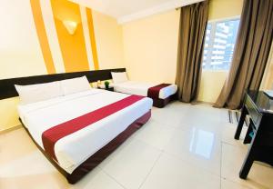 Sun Inns D'mind 3 Seri Kembangan客房内的一张或多张床位