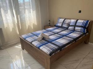 a bed with two towels on it in a bedroom at J&S Lux Central Suite 1 in Alexandroupoli