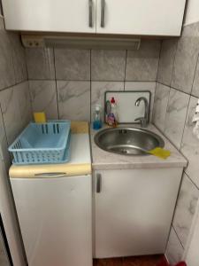 a small kitchen with a sink and a counter at Studio avec accès direct à mer à Bijela - Appart numéro 1 in Bijela