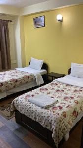 Letto o letti in una camera di Bag Packer's Lodge
