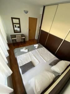 Postel nebo postele na pokoji v ubytování Apartman Nika