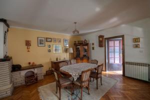 a dining room with a table and chairs at Two Towers in Pančevo +22 photos