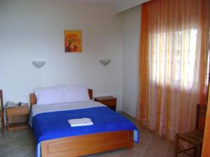 A bed or beds in a room at Panorama Spa Hotel