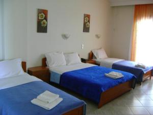 A bed or beds in a room at Panorama Spa Hotel