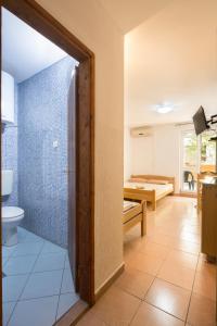 a bathroom with a shower and a toilet in a room at Apartments Antic in Budva +41 photos