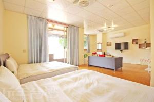 Uma cama ou camas num quarto em Nantou Fruit House