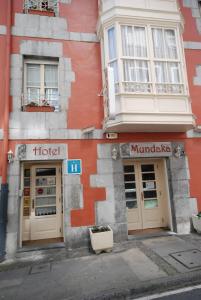 a building with two doors on the side of it at Eco Hotel Mundaka in Mundaka