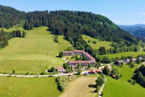 an aerial view of a house in the middle of a field at FeWo Almherzl mit Hallenbad,Sauna,Panoramablick,renoviert in Missen-Wilhams
