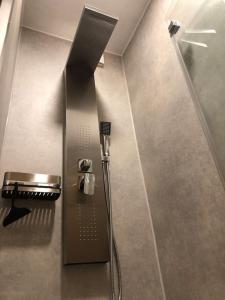 a shower stall in a bathroom with a glass door at FeWo Almherzl mit Hallenbad,Sauna,Panoramablick,renoviert in Missen-Wilhams