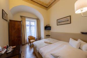Posteľ alebo postele v izbe v ubytovaní Hotel Elite Prague
