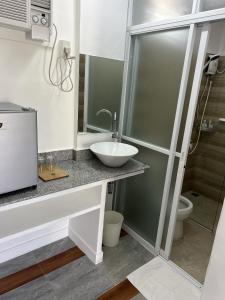 a bathroom with a sink and a toilet at Manta Dream Resort in Panglao
