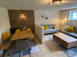 a living room with a couch and a table at Appartment Kapferer in Gries im Sellrain