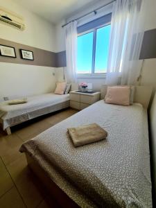 Postel nebo postele na pokoji v ubytování Modern and stylish apartment in Vanessa complex