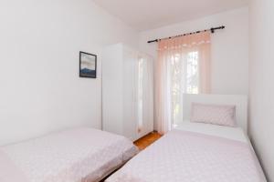 Postel nebo postele na pokoji v ubytování Apartments Martic