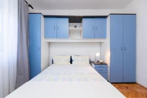 Postel nebo postele na pokoji v ubytování Apartments Martic