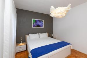 Postel nebo postele na pokoji v ubytování Apartments Martic