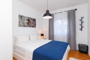 Postel nebo postele na pokoji v ubytování Apartments Martic + 37 fotografií