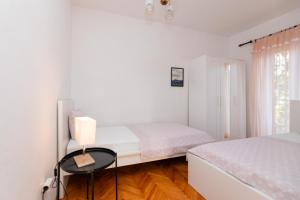 Postel nebo postele na pokoji v ubytování Apartments Martic