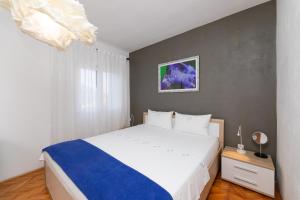Postel nebo postele na pokoji v ubytování Apartments Martic