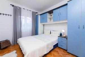 Postel nebo postele na pokoji v ubytování Apartments Martic