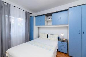 Postel nebo postele na pokoji v ubytování Apartments Martic