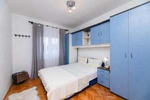 Postel nebo postele na pokoji v ubytování Apartments Martic