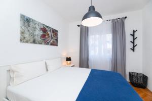 Postel nebo postele na pokoji v ubytování Apartments Martic