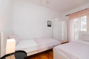 Postel nebo postele na pokoji v ubytování Apartments Martic