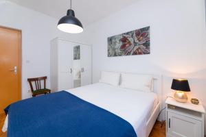 Postel nebo postele na pokoji v ubytování Apartments Martic