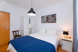 Postel nebo postele na pokoji v ubytování Apartments Martic