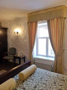 Krevet ili kreveti u jedinici u okviru objekta Taanilinna Hotell