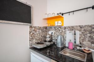 Kuchyň nebo kuchyňský kout v ubytování Newway Apartments