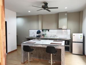 A kitchen or kitchenette at My Friend's House Villa