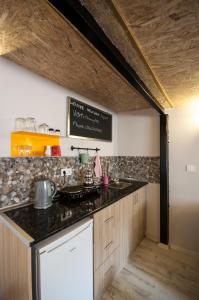 Kuchyň nebo kuchyňský kout v ubytování Newway Apartments