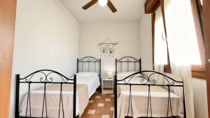 Posteľ alebo postele v izbe v ubytovaní Casa Vacanza Vista Mare Salento