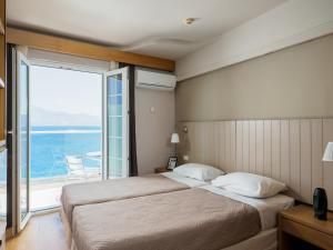 Postel nebo postele na pokoji v ubytování El Greco Hotel