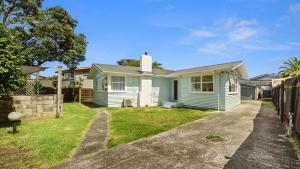 Ein Haus in den Vororten von Sydney in der Unterkunft The Links - Mount Maunganui Holiday Home in Mount Maunganui