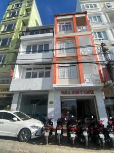 a group of motorcycles parked in front of a building at VALENTINE Hotel in Da Lat