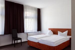 Postel nebo postele na pokoji v ubytování Hotel Eckstein