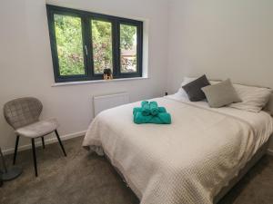 a bedroom with a bed with a bow on it at Millhouses Hideaway in Sheffield