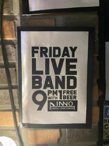a sign on a wall that reads friday live band with beer at INNO Hostel & Pub Lounge Hongdae in Seoul