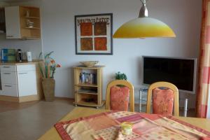 TV a/nebo společenská místnost v ubytování Tief 12 Hafenkieker mit Internet 53