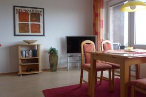 TV a/nebo společenská místnost v ubytování Tief 12 Hafenkieker mit Internet 53