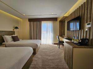 Edom Hotel tesisinde bir televizyon ve/veya eğlence merkezi