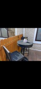 a table and chairs and a table and a table and a table and chairs at Harmony House enclosed property near beach and lake in Tramore