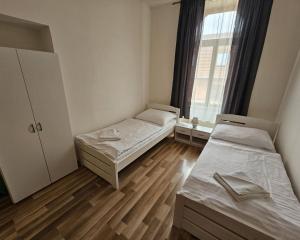 Postel nebo postele na pokoji v ubytování Penzión TIME