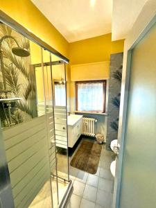 a bathroom with a shower and a tub and a toilet at Nuovi bilocali Panta Rei - Suite dell'Aria in Senigallia